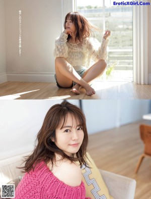 A woman sitting on top of a bed wearing a white sweater.