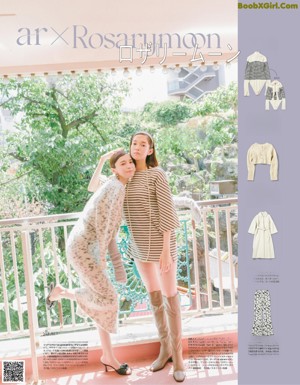 A couple of women standing next to each other in front of a store.