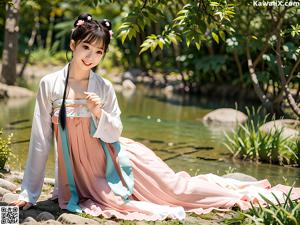 A woman in a white kimono standing in a pond.