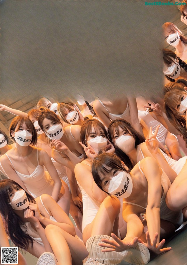 A group of young women wearing face masks posing for a poster.