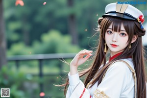 a woman in a chinese outfit is posing for a picture